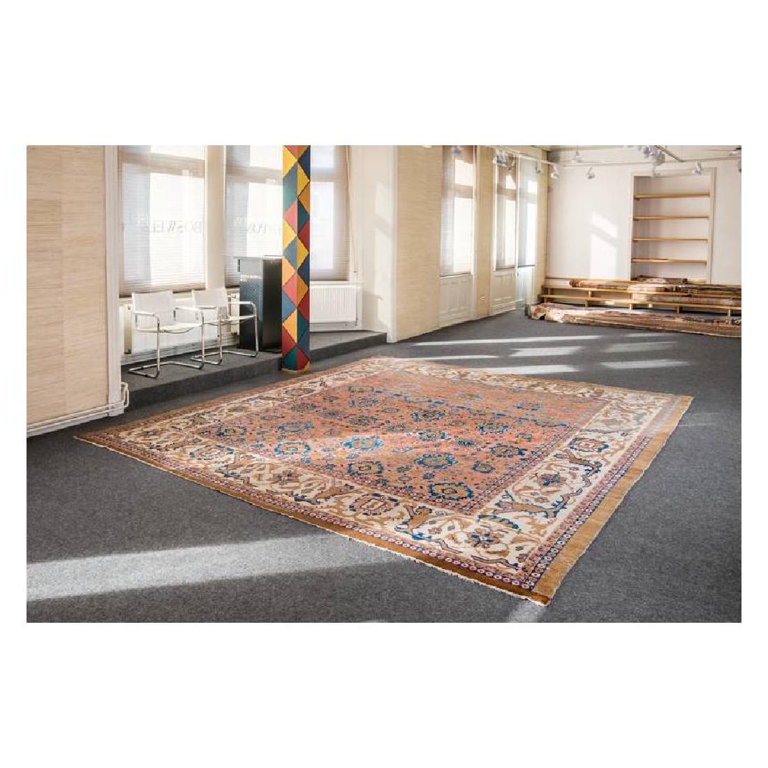 Bakhshaish: Second half 19th century, 428 x 378 cm, North West Persia, Azerbaijan In this large and nearly square carpet from the Bakhshaish area, the stylised lions in the wide, white-ground border are a strikin