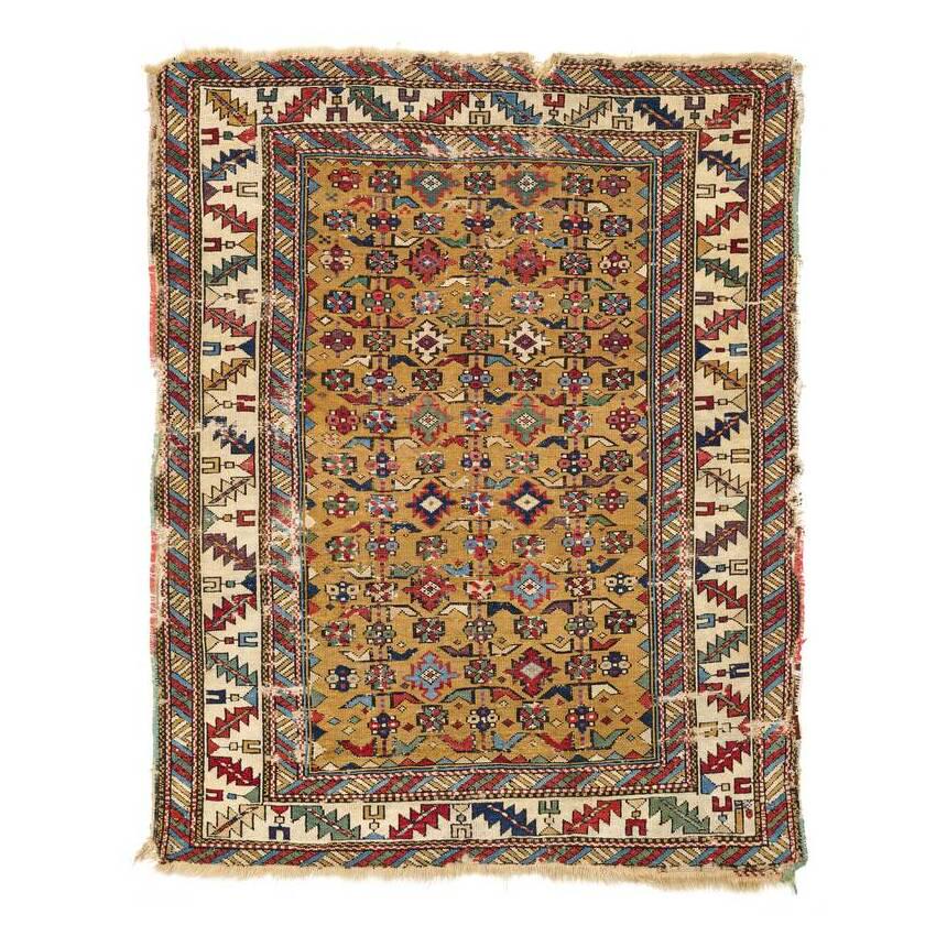 Shirvan: First half 19th century, 120 x 98 cm, East Caucasus A classic Khyrdagyd repeat adorns the mustard yellow field; the white main border contains a leaf and calyx vine, and the secondary borders show a d