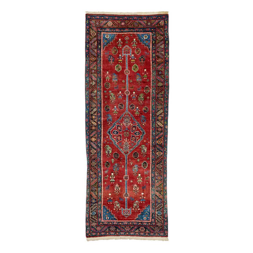 Bakhshaish Long Rug: Ca. 1900, 280 x 101 cm, North West Persia, Azerbaijan The red field contains a hexagonal central medallion from which extend two extraordinarily long poles ending in points. Small hexagons, botehs and