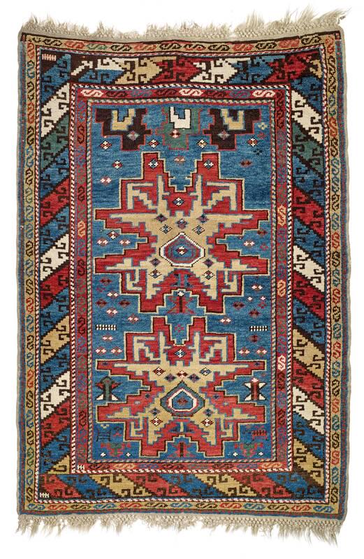 Avar: Late 19th century, 126 x 91 cm, North East Caucasus, Daghestan The blue field contains two large Lesghi stars drawn in the rectangular kilim style that is characteristic of Avar pile rugs and flatweav