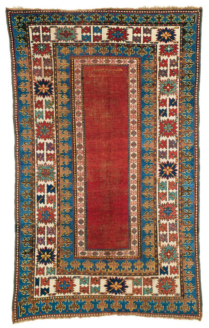 Kazak: Second half 19th century, 225 x 140 cm, South West Caucasus Obvious signs of age and wear, minor repilling in the red field. Brown sections almost completely corroded. Original selvedges, original upp