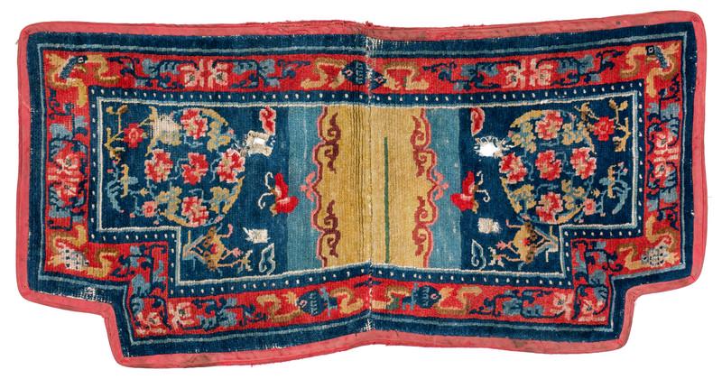 Gyantse Makden: First quarter 20th century, 64 x 130 cm, Central Asia, South Tibet Signs of age and wear, edged all around with red fabric.