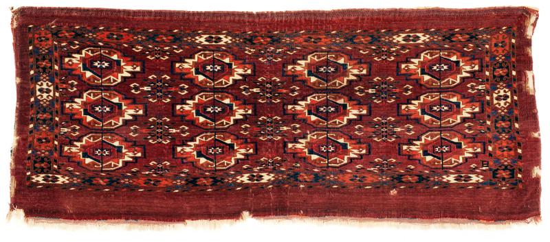 Tekke Torba: Mid 19th century, 48 x 114 cm, Central Asia, West Turkestan Damage to the sides, pile in good condition. Parts of both kilim finises survived. 
