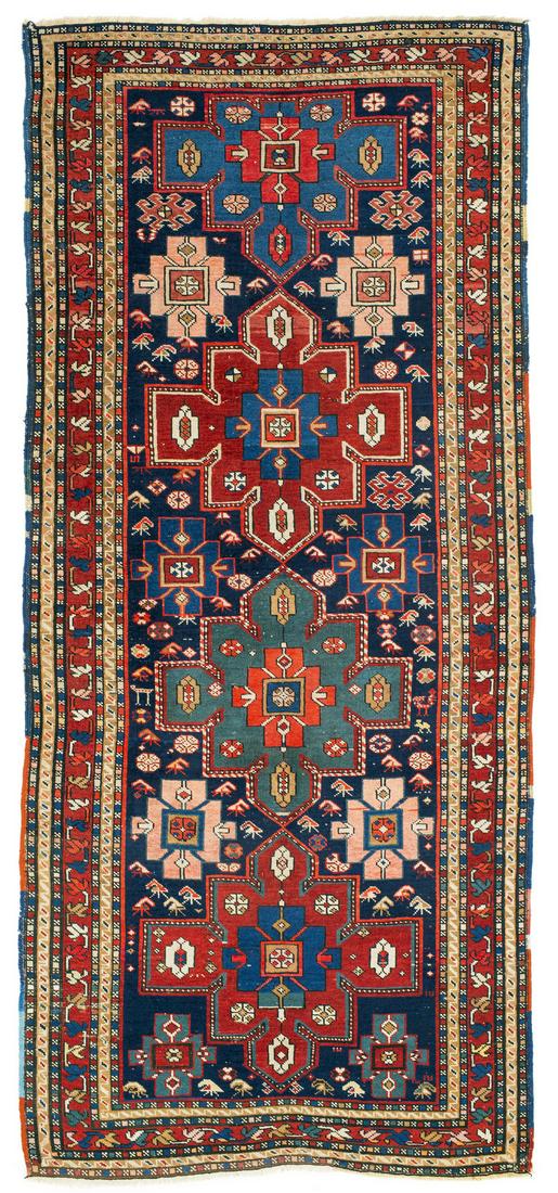Karabagh: ca. 1900, 257 x 115 cm, South Caucasus, Azerbaijan Signs of age and wear. Lower finish repiled in places. Smaller repairs. Original sides. Some red discolouration.
