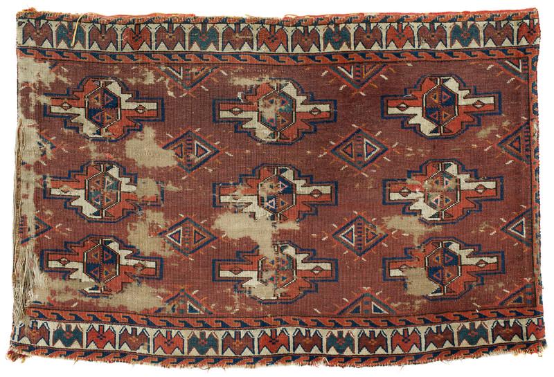 Yomut Chuval: first half 19th century, 63 x 94 cm, Central Asia, West Turkestan Heave signs of age and wear. Missing areas. Both of the sides and finishes cut. 