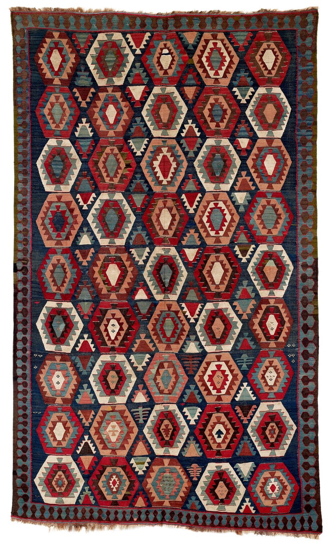 Garmsar Kilim: Late 19th century, 284 x 167 cm, North Persia, Veramin Good condition except for minor rewoven areas, the original overcasting along the sides is preserved. Several rows of the weft have been rewoven 