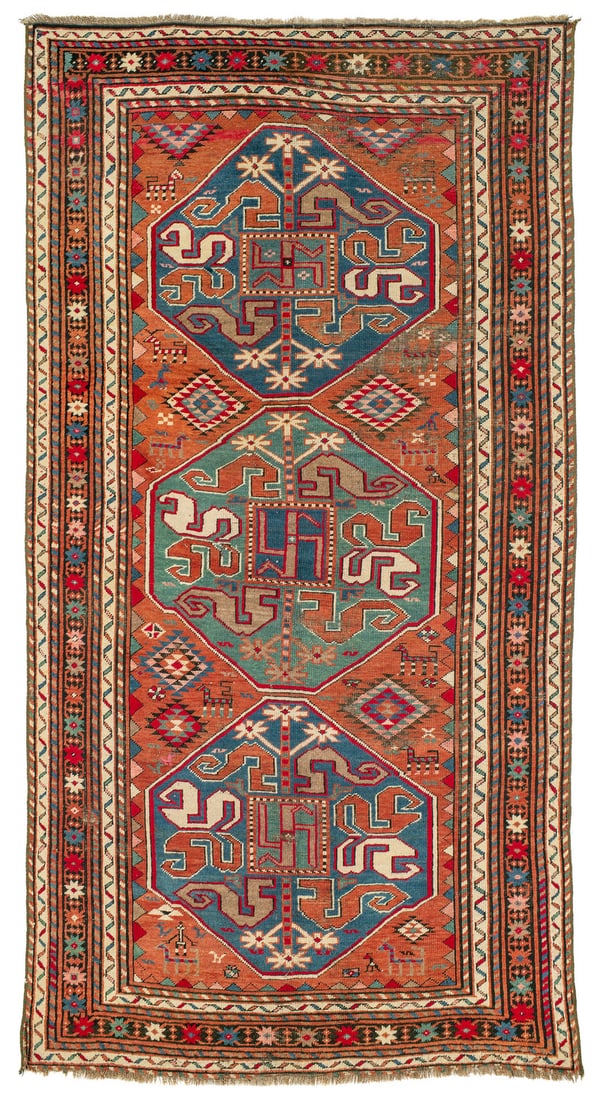 Chondzoresk: ca. 1900, 270 x 141 cm, South Caucasus, Armenia Uniformly low pile, which is worn away down to the foundation in places. Cut sides and replaced selvedges. A torn area in the side of the lower lef