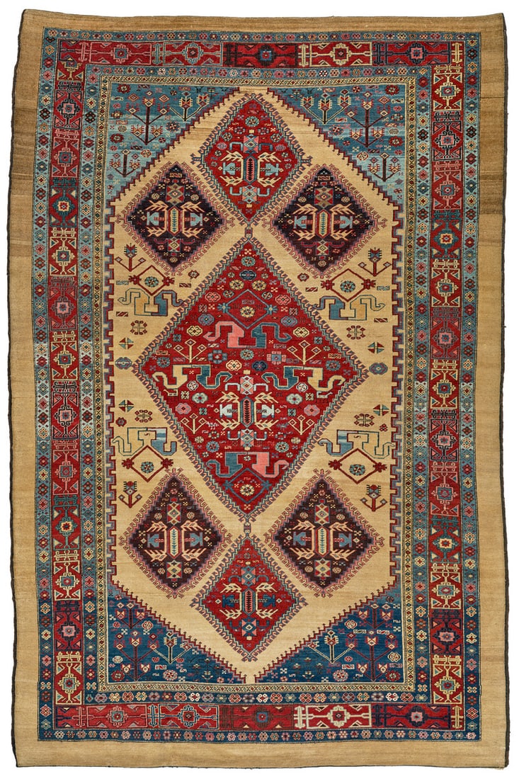 Bakhshaish: second half 19th century, 329 x 218 cm, North West Persia, Azerbaijan This large Bakhshaish shows a strikingly individual design. In the sand-coloured field, a large diamond is associated with six sma