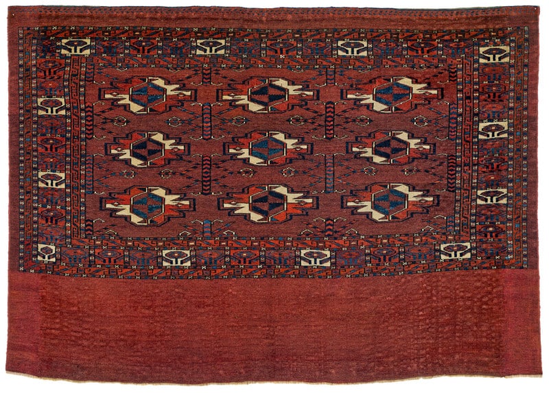 Karadashli Chuval: first half 19th century, 85 x 118 cm, Central Asia, West Turkestan This nine-gul chuval of the Karadashli tribe shows a design of balanced proportions. The chemche secondary guls are unusually large. 