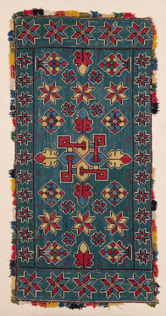 Agedyna: ca. 1800, 125 x 46 cm, South Sweden, Skane, Torna or Bara District Produced in the Torna or Bara District around 1800, this carriage cushion belongs to the same group as the example published in the 1