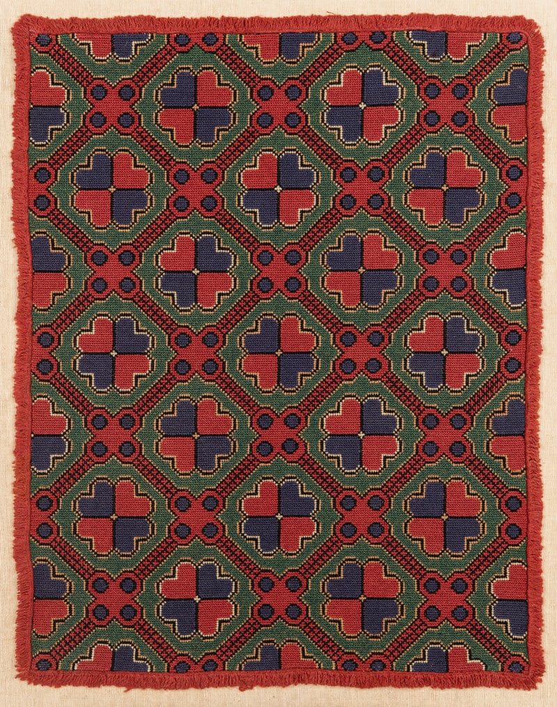 Stoldyna: ca. 1870, 84 x 62 cm, South Sweden, Skane, Torna or Bara District The face of a chair cushion. Wool embroidery in the cross stitch technique on a linen foundation. The green field is covered in a