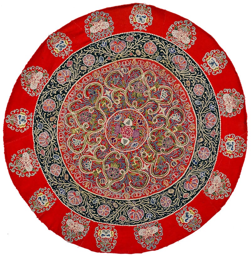 Rasht Embroidery: late 19th century, 94 cm Durchmesser, North Persia, Gilan An elaborate embroidery in silk and wool yarn on a red and dark blue wool flannel foundation. This circular tablecloth was placed onto one of