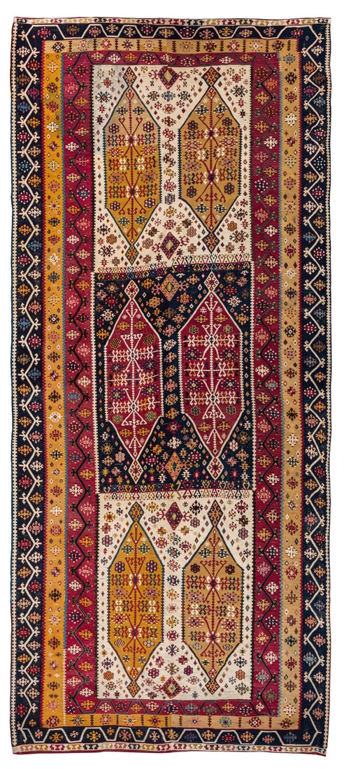Reyhanli Kilim: mid 19th century, 340 x 148 cm, South East Anatolia A two-panel Reyhanli kilim, very finely woven, with white cotton sections. Published as early as 1979 in the reference book, "Kilims" by
