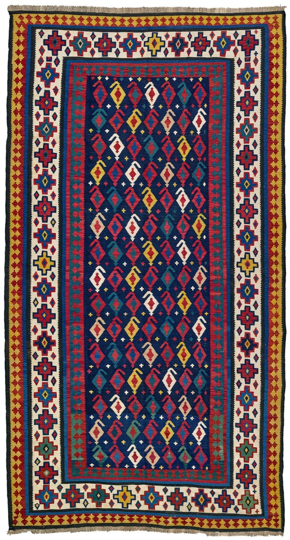 Talish Kilim: second half 19th century, 325 x 180 cm, South East Caucasus A large and finely woven Talish kilim. In the midnight blue field, diamond-shaped botehs in varying colours are arranged in parallel rows