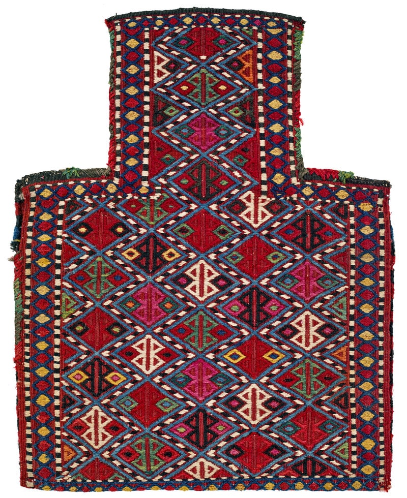 Azeri Salt Bag: late 19th century, 57 x 45 cm, South Caucasus, Azerbaijan A blue-ground salt bag with a design in brilliant and diverse colours brocaded in the cicim technique. A diamond lattice extends across the