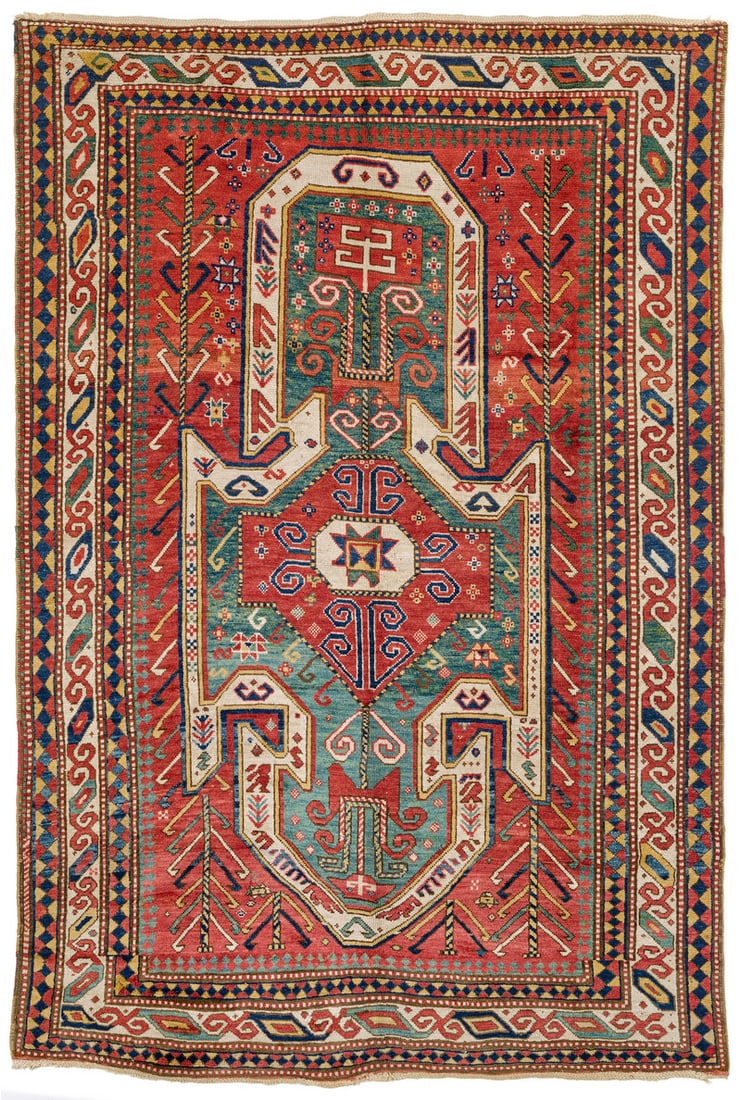 Sevan Kazak: second half 19th century, 273 x 179 cm, South West Caucasus The green shield medallion takes up almost the whole of the red field in the vertical direction. A red cartouche placed at its centre enclos