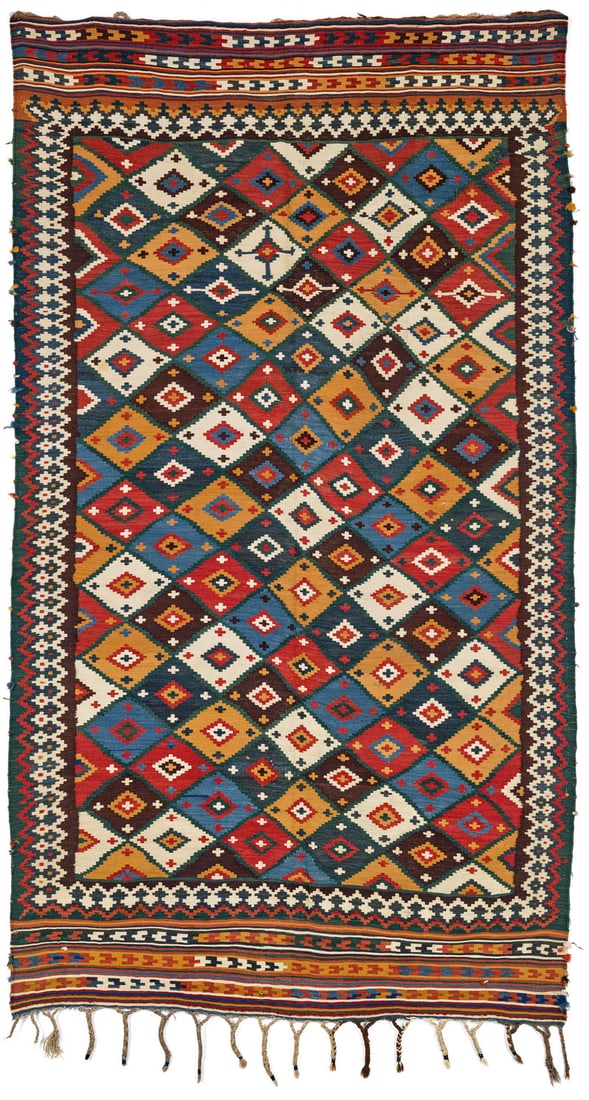Qashqai Kilim: late 19th century, 275 x 153 cm, South West Persia, Fars The field of this Qashqai kilim is covered in a tile design composed of diamonds in different colours whose finely stepped outlines combine