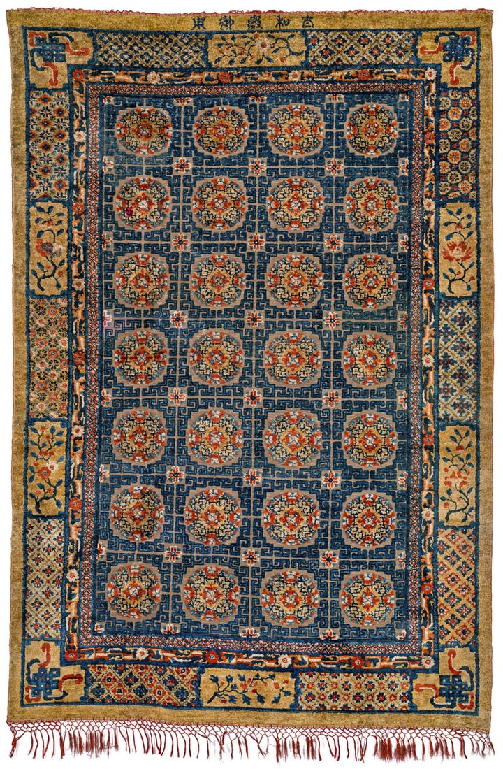 Beijing Palace Carpet: mid 19th century, 355 x 174 cm, North East China This large silk rug displays a compartment design and a ground brocaded in metal. The five characters in the upper finish indicate the room in the Impe