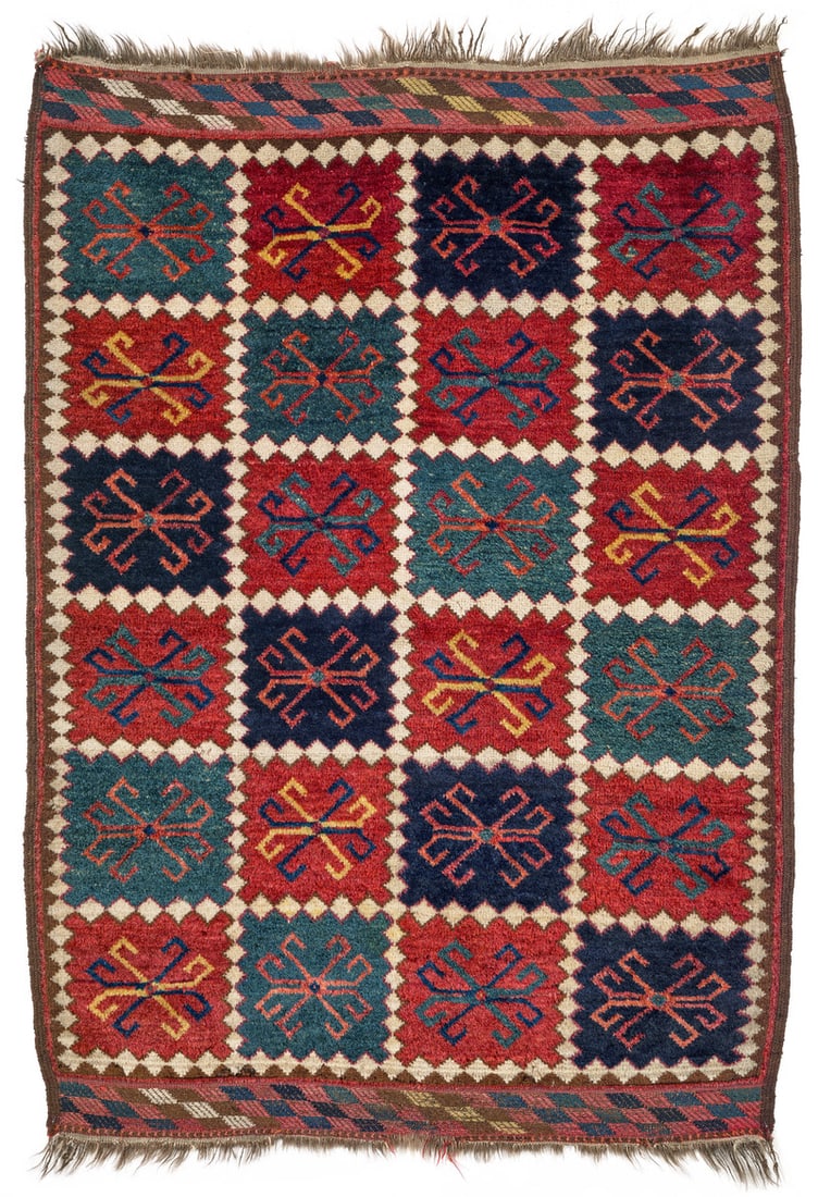 Ersari: second half 19th century, 128 x 89 cm, Central Asia, middle Amu Darya valley This very rare small-format Ersari is woven in a chequerboard design of 24 compartments in steel blue, green and red which