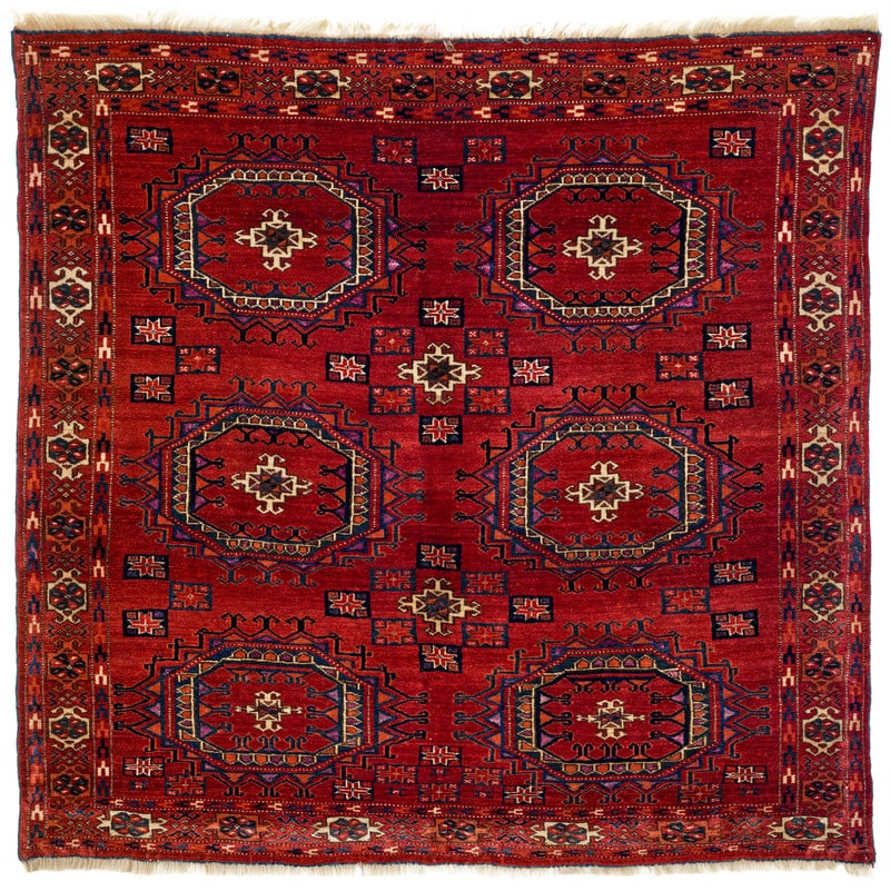 Tekke Sitting Rug: mid 19th century, 91 x 93 cm, Central Asia, West Turkestan A square Tekke sitting rug. The field and border designs are not merely inspired by Salor models; they are literal representations of them.