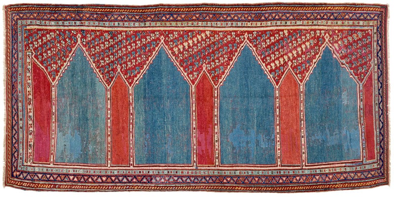 Ushak Saf: 18th century, 328 x 154 cm, West Anatolia A rare multiple prayer rug woven in an architectural, clearly drawn and unadorned design. Four blue-green arched fields with plain interiors and pointed