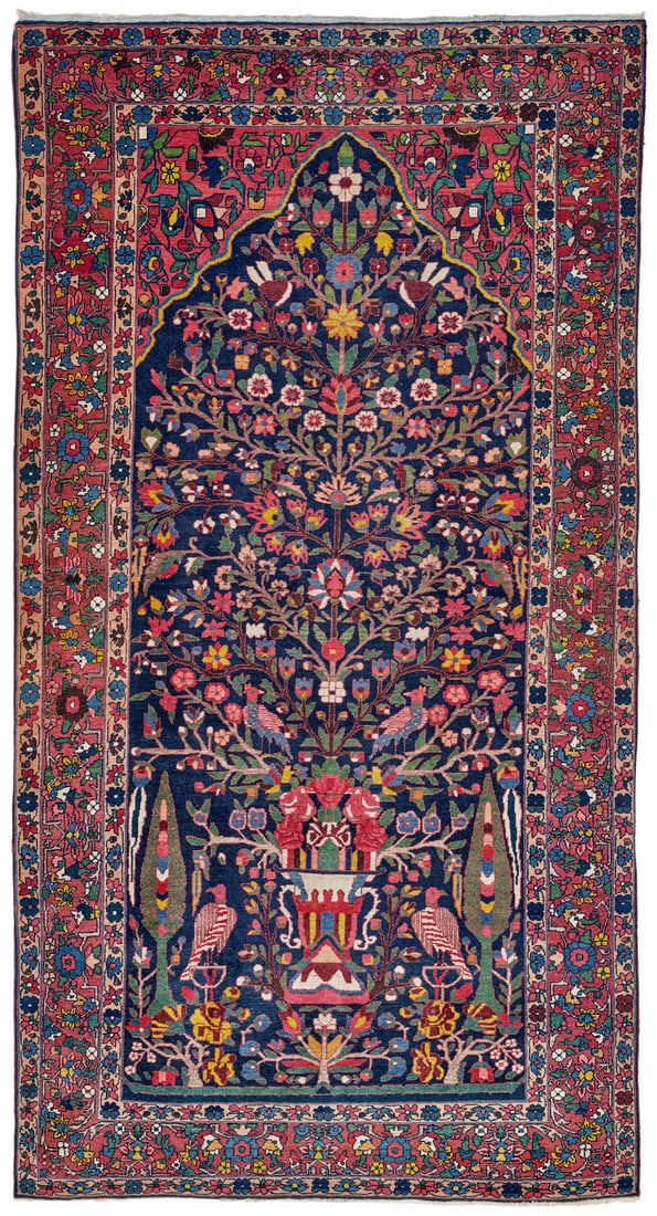 Bakhtiari Shalamzar: first quarter 20th century, 312 x 166 cm, Western Central Persia, Chahar Mahal In the dark blue field, the mirror-image flowering branches of a tree of life fill almost the entire space beneath the