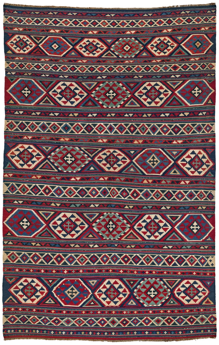 Shirvan Kilim: second half 19th century, 258 x 167 cm, East Caucasus This finely woven single-panel Shirvan kilim shows a design typical of the provenance – horizontal stripes that vary in width and