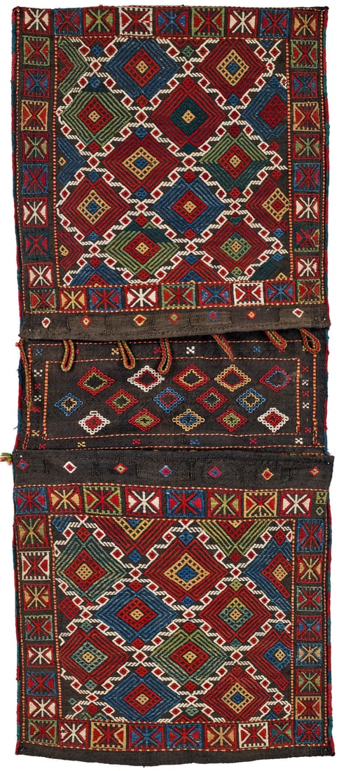 Armenian Khorjin: late 19th century, 131 x 55 cm, South Caucasus, Karabagh A design of diamonds arranged in offset rows has been brocaded onto a uniformly dark brown ground. Beautiful colours.