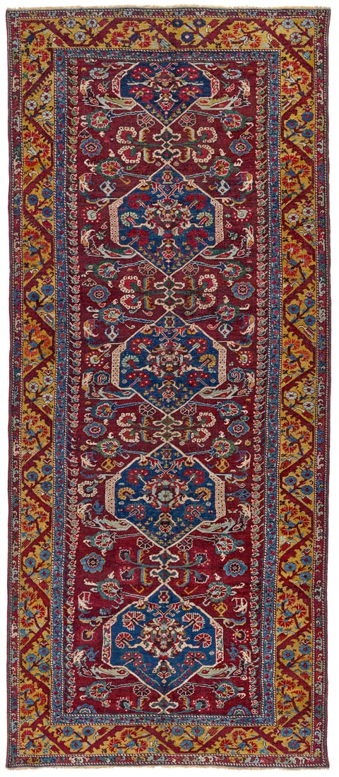 Kula: late 18th century, 337 x 140 cm, West Anatolia The long format of this Demirci Kula is striking. In this respect, it resembles an example published by Eskenazi in 1983. Typical of the provenance, the