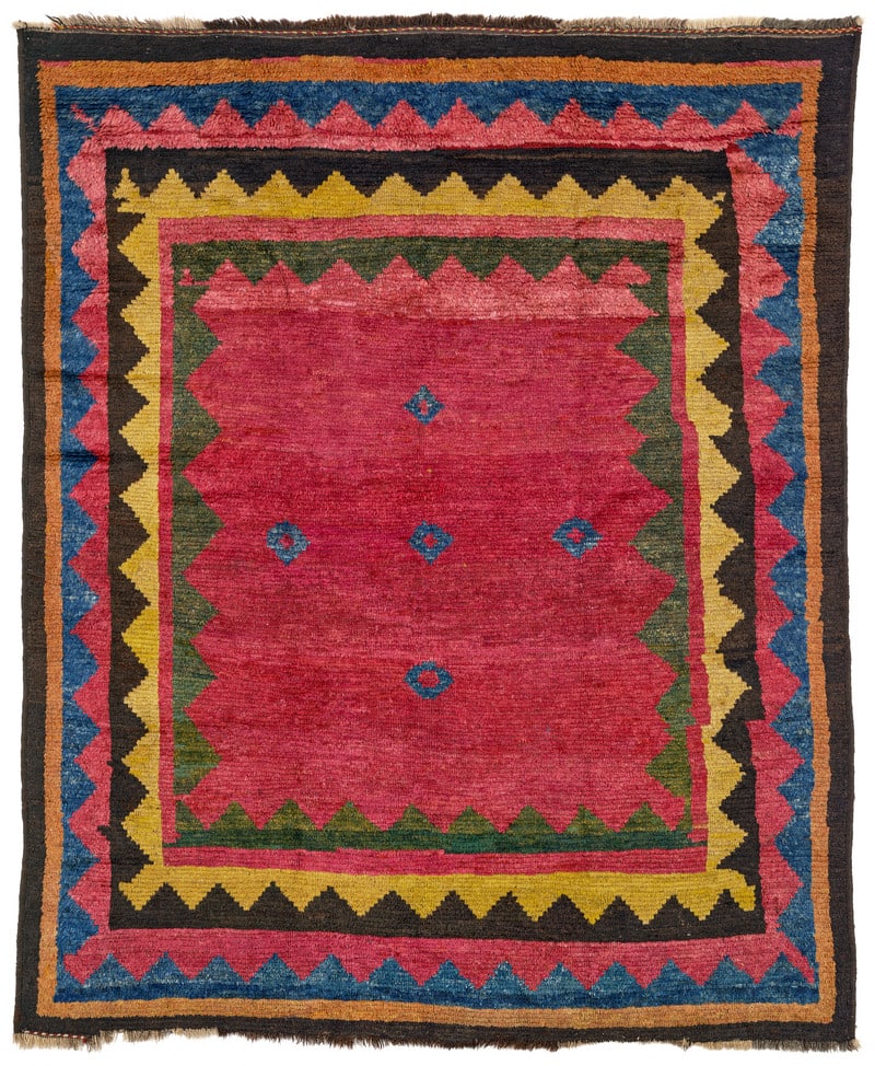Luri Gabbeh: late 19th century, 190 x 155 cm, Western Central Persia Except for five small blue blossoms, the red field of this gabbeh is an empty space only enlivened by slight variations in colour. It is