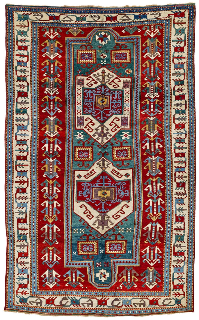 Fachralo Kazak: second half 19th century, 227 x 140 cm, South West Caucasus A narrow green band comprising two white-ground Fachralo cartouches and six box shapes lies on the central axis of the red field. An