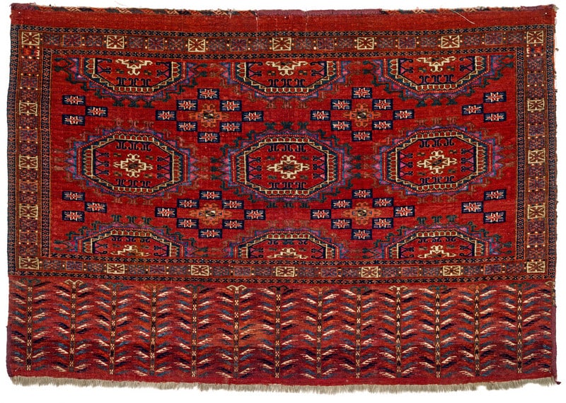 Tekke Chuval: first half 19th century, 72 x 107 cm, Central Asia, West Turkestan A Tekke chuval of outstanding quality featuring three complete Salor guls and six that are overlaid and halved by the border. The