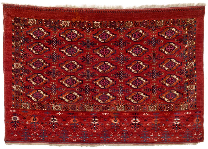 Tekke Chuval: first half 19th century, 78 x 114 cm, Central Asia, West Turkestan A Tekke bag face decorated with 25 small primary guls. Their inner cruciforms are knotted in ruby silk that is now corroded. Chemche