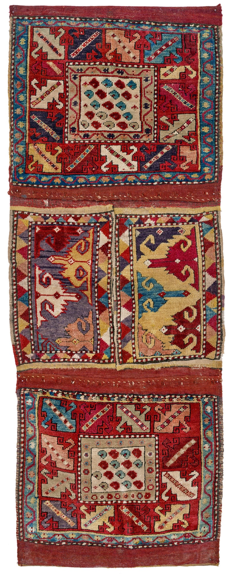 Milas Heybe: mid 19th century, 122 x 47 cm, South West Anatolia A very rare double bag from Milas with pile-woven faces and a similarly pile-woven connecting panel. The outstanding quality seen in every respect