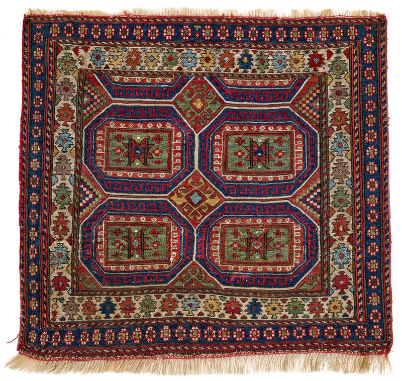 Shahsavan Bag Face: mid 19th century, 56 x 60 cm, North West Persia, Azerbaijan This red-ground sumakh bag face used to be part of a khorjin. In the field, four blue octagons with a green box at their centres fill