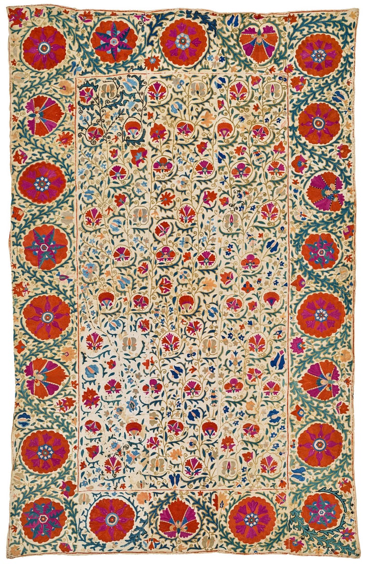 Kermina Suzani: mid 19th century, 214 x 142 cm, Central Asia, South West Uzbekistan A gorgeous Kermina suzani composed of five panels, largely embroidered in yurma chain stitch with small details in basma. Lustrous