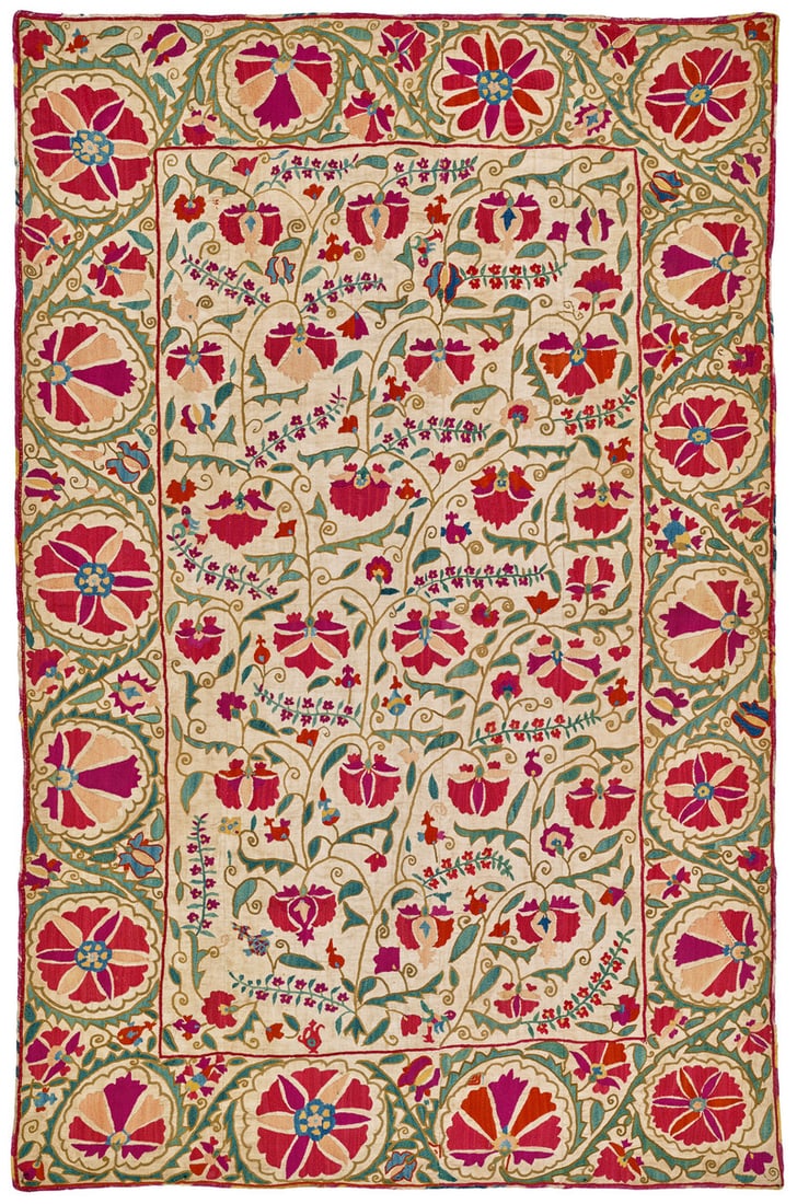 Bokhara Nim Suzani: mid 19th century, 153 x 99 cm, Central Asia, Uzbekistan A Bokhara suzani in the nim format with an ascending design of thin, elegantly curved stems twining upwards. The large blossoms are shown as