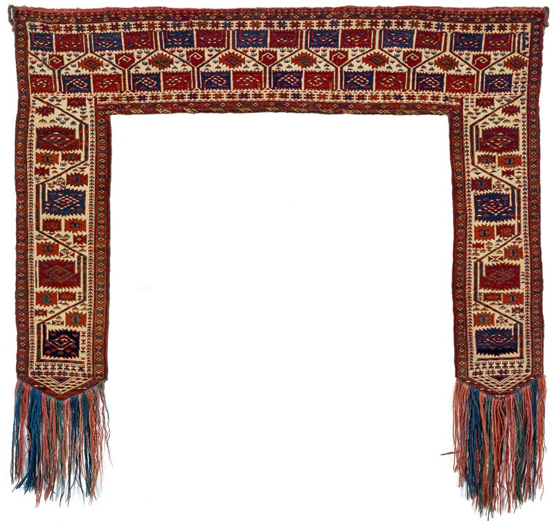 Tekke Kapunuk: early 19th century, 88 x 24 x 119 cm, Central Asia, West Turkestan Kapunuks were hung above the crossbeam of the door inside the tent during wedding ceremonies. They had great symbolic significance