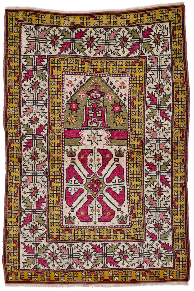 Monastir Prayer Rug: late 19th century, 167 x 114 cm, South East Europe, Greece, Macedonia This prayer rug of the Monastir group displays a large cruciform device in the white field below the olive prayer arch. The