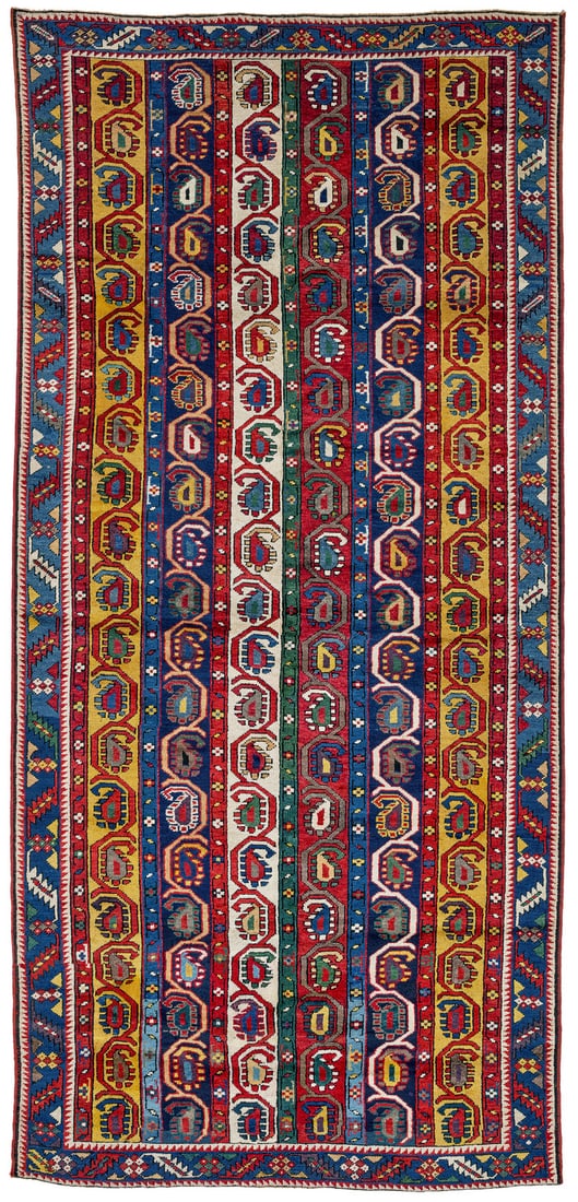 Genje: second half 19th century, 274 x 130 cm, Central Caucasus, Elisabethpol A repeat of yellow, white, blue and red vertical stripes. Within these, an angular vine undulates around botehs alternately