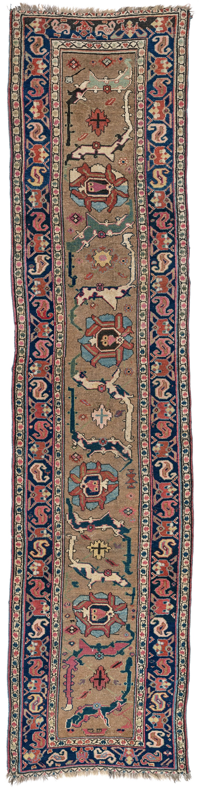Hamadan Long Rug: ca. 1900, 365 x 90 cm, West Persia In the narrow light brown field, individual designs have been joined together to create a vine of arabesques and palmettes. Known as "kenare" in Persia, two narrow