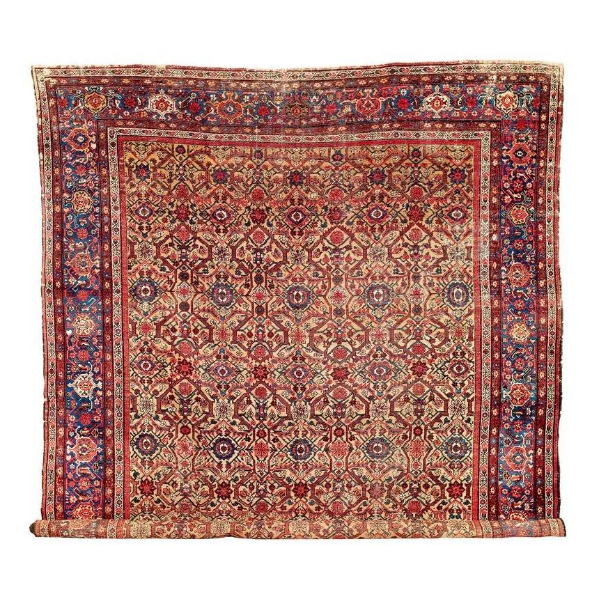 Mahal: Late 19th century, 488 x 366 cm, West Persia, Arak region Obvious signs of wear. Several holes, tears and missing sections, low spots in the pile. Some damage to the sides, reduced ends.