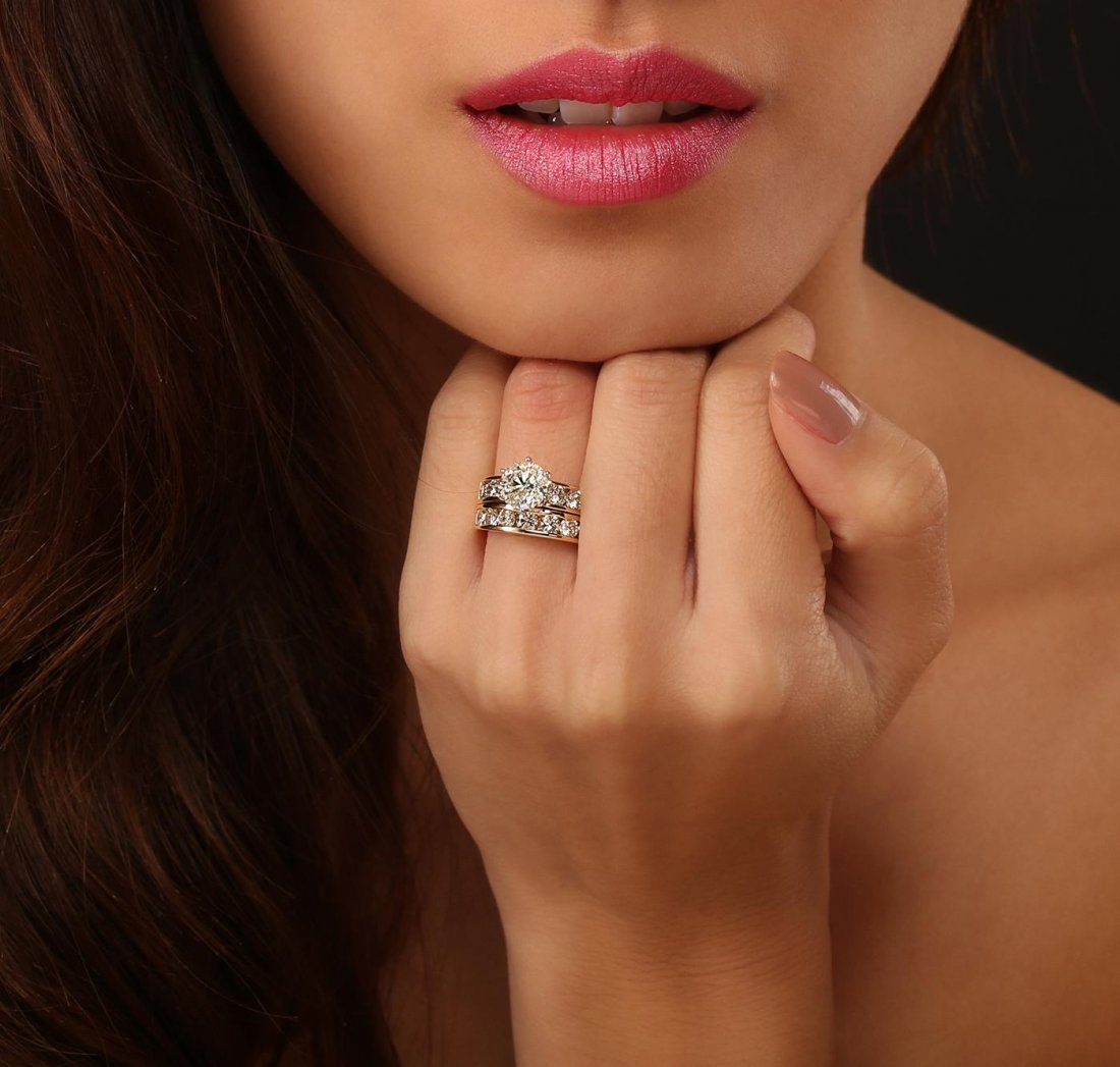 14KT Yellow Gold 1.60ct I-1/M Diamond Wedding Ring Set: One electronically tested 14KT yellow gold ladies cast & assembled diamond wedding set. Condition is good. The wedding set includes a diamond engagement ring and a matching diamond wedding band. The e