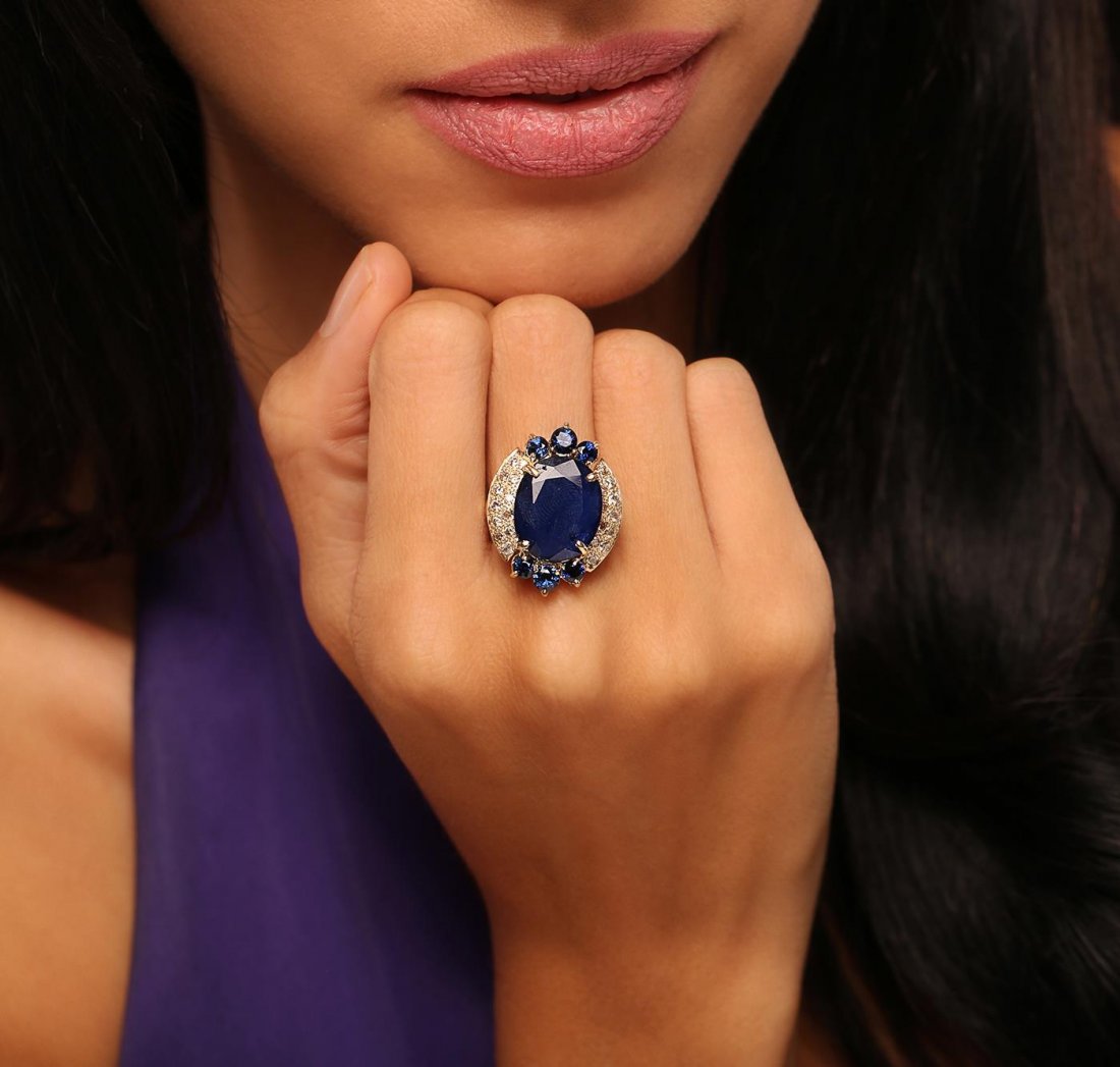 14KT Yellow Gold 10.94ct Sapphire and Diamond Ring: One electronically tested 14KT yellow gold Ladies combination cast & assembled ring with a bright polish finish. Condition is new. Identified with markings of "K14". Containing: One prong set oval mod