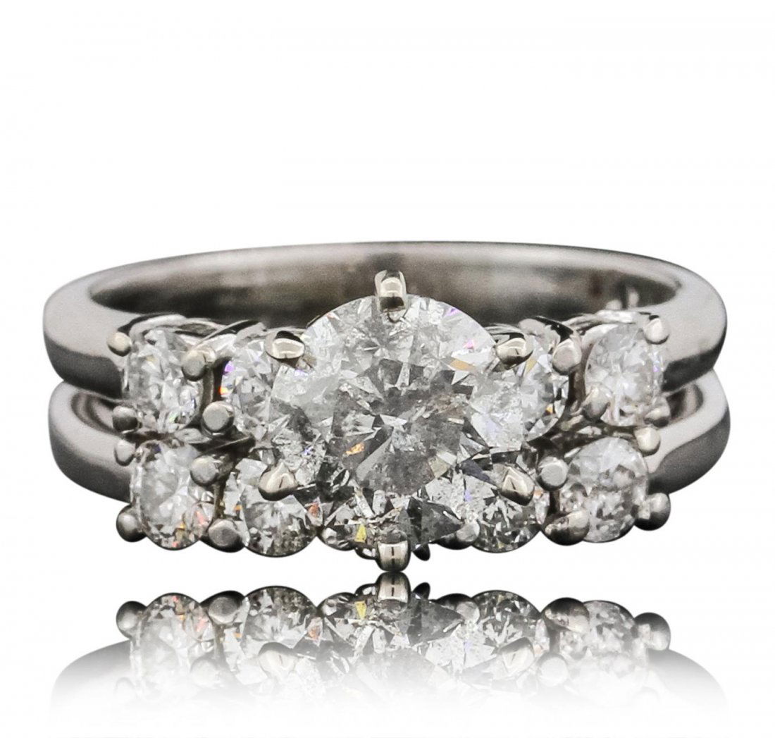 14KT White Gold 2.73ctw Brilliant Cut Diamond Wedding: One electronically tested 14KT white gold ladies cast & assembled diamond wedding set. The wedding set includes a diamond engagement ring and a matching diamond wedding ring. The engagement ring featu