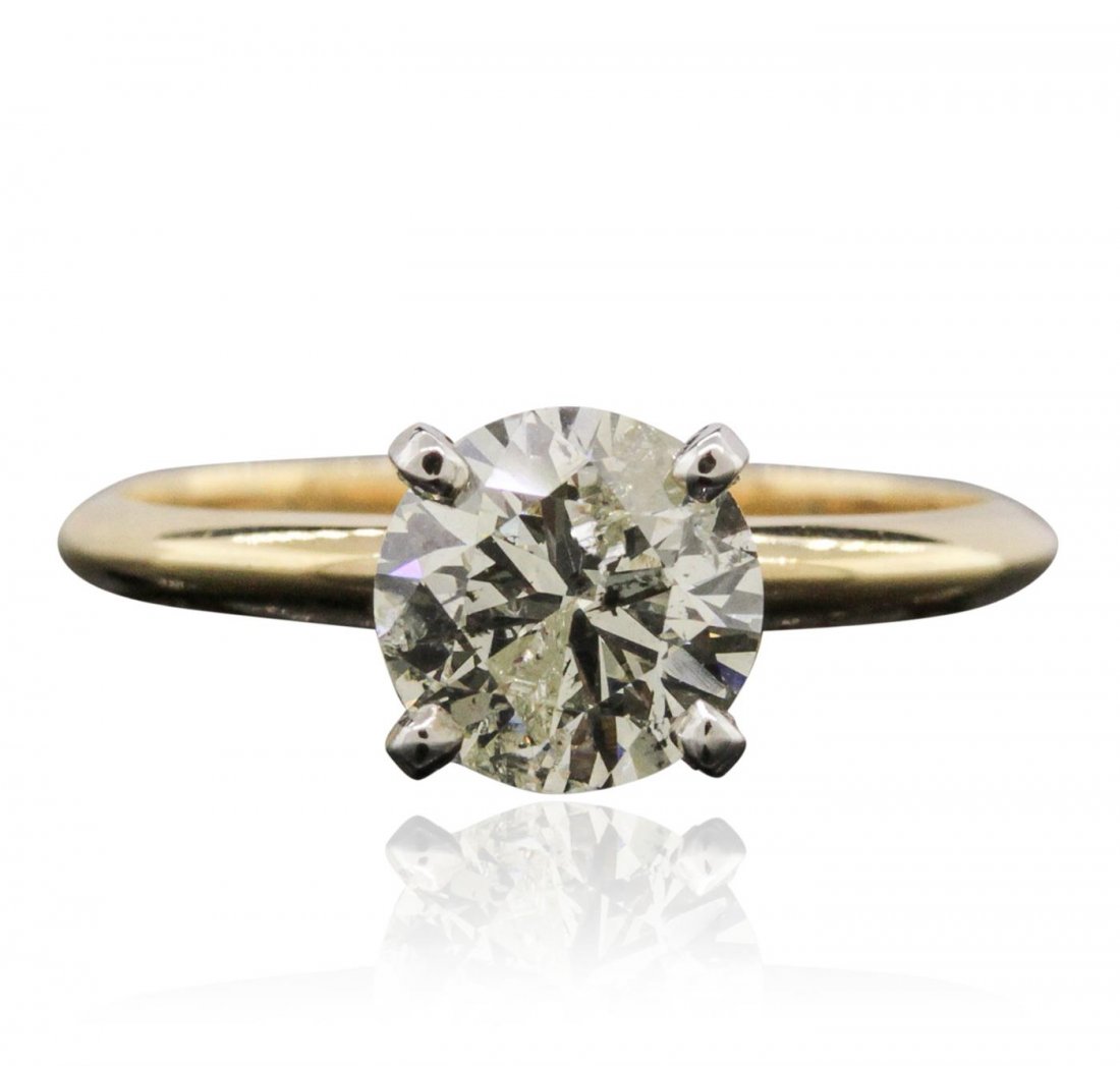 14KT Yellow Gold 1.29ctw Diamond Ring: One electronically tested 14KT yellow gold ladies cast diamond solitaire ring with a bright polish finish. Condition is new, good workmanship. The ring is completed by a one and one-half millimeter wi
