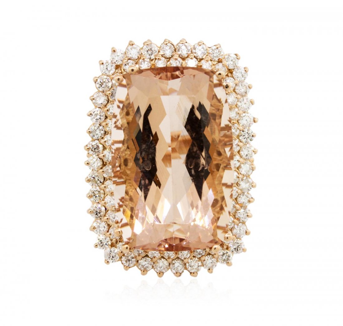 14KT Rose Gold GIA Certified 40.64 ctw Morganite and: One electronically tested 14KT rose gold ladies cast morganite and diamond ring with a bright polish finish. Condition is new, good workmanship. The featured morganite is set within a two tiered diamo