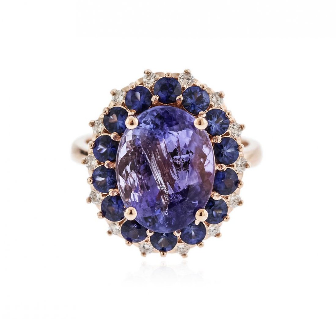 14KT Rose Gold 5.94 ctw Tanzanite, Sapphire and Diamond: One electronically tested 14KT rose gold ladies cast tanzinite, sapphire and diamond ring with a bright polish finish. Identified with markings of "14K". Condition is new. Containing: One prong set ov