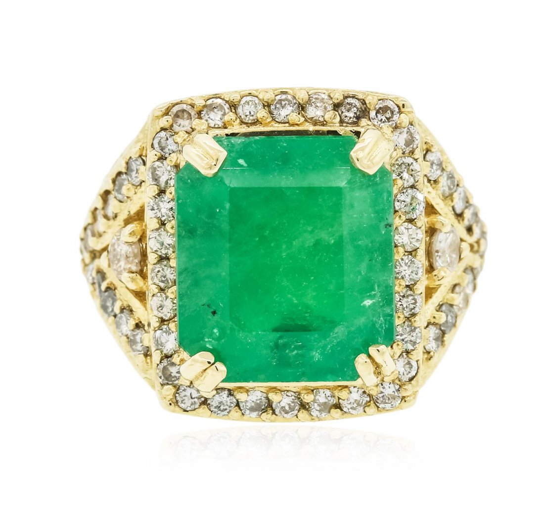 14KT Yellow Gold 9.19 ctw Emerald and Diamond Ring: One electronically tested 14KT yellow gold Ladies combination cast & assembled ring with a bright polish finish. Condition is new. Containing: One prong set emerald standard step cut natural emerald,