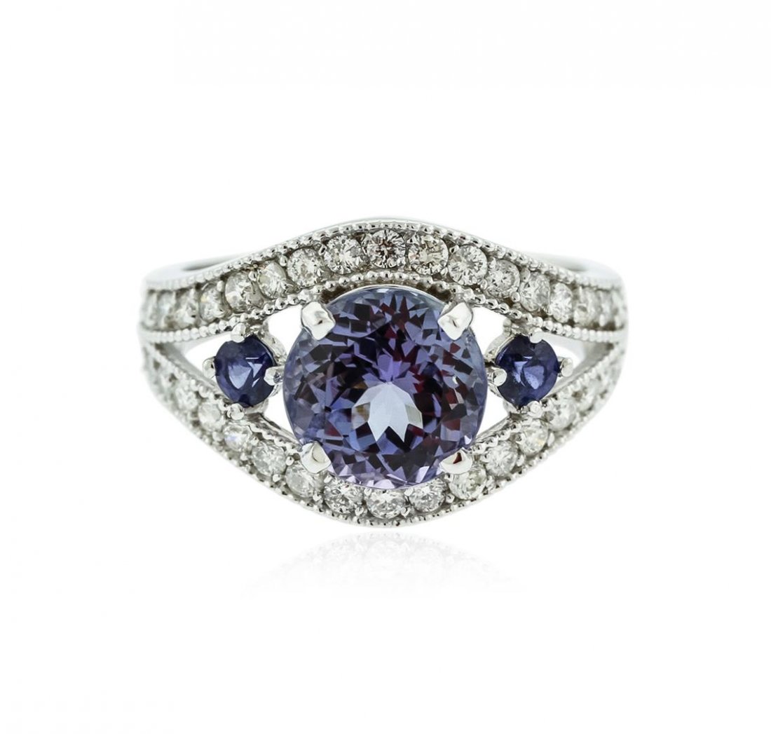 14KT White Gold 2.58 ctw Tanzanite, Sapphire and: One electronically tested 14KT white gold ladies cast tanzinite, sapphire and diamond ring with a bright polish finish. Identified with markings of "K14". Condition is new. Containing: One prong set r